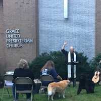 <p>Smith leads the service at Grace United Presbyterian Church Thursday.</p>