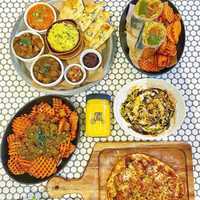 <p>Curry Up Now serves traditional Indian dishes repackaged into modernized street food staples, like tikka masala burritos, deconstructed samosas, makini bowls and more.</p>