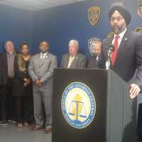 <p>New Jersey Attorney General Gurbir S. Grewal addresses the public, backed by state, local and federal law enforcement officials.</p>