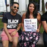 <p>Three of the participants at the vigil in Bridgeport on Sunday to protest violence in Charlottesville share a message.</p>