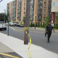 <p>A Hackensack police officer on the crime scene.</p>