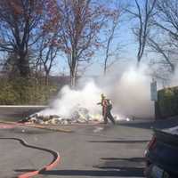 Massive Pile Of Trash Dumped In Parking Lot Goes Up In Flames, Closes Down Maryland Roadway