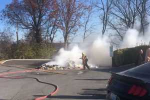 Massive Pile Of Trash Dumped In Parking Lot Goes Up In Flames, Closes Down Maryland Roadway