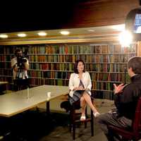 <p>Roh interviews a subject for a CUNY TV story.</p>