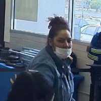 <p>A surveillance still of the wanted woman</p>