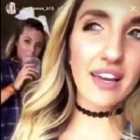 <p>The WPU student at right posted one video, while the woman behind</p>