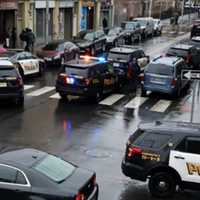 <p>Police initially converge at the Jersey City site.</p>