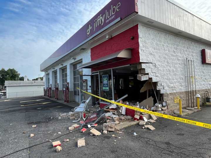 Jiffy Lube at 475 North Main Street in East Longmeadow after a Jeep fleeing police crashed into it early Thursday morning, Aug. 24.