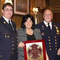 <p>Lodi firefighters present award to Joanne Ciolino, honoring her late husband Joe&#x27;s 50 years of service.</p>