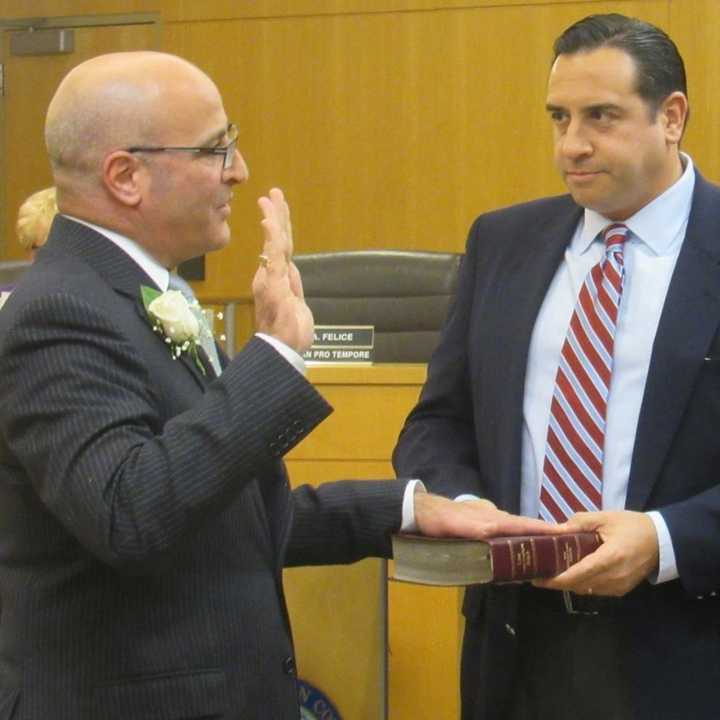 John Felice being sworn to office.