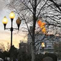 <p>Flames could be seen shooting from the roof of the Brownstone in Paterson on Monday, March 6.</p>