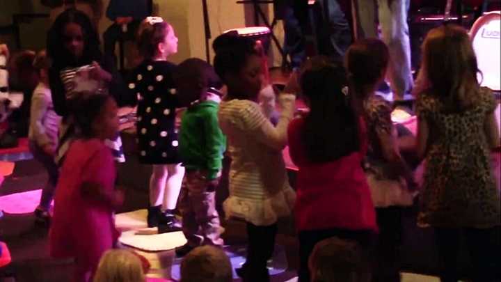 Kids dance along to a Jungle Gym Jam performance in 2014.