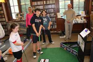 Kids Play Haunting Game Of Mini-Golf At Warner Library