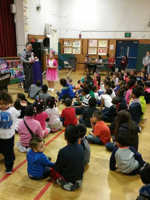 Norwalk Police Bring Gifts To 150 Kids At Holiday Party