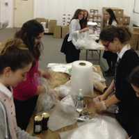 <p>Volunteers package up goodies for Jewish troops overseas.</p>