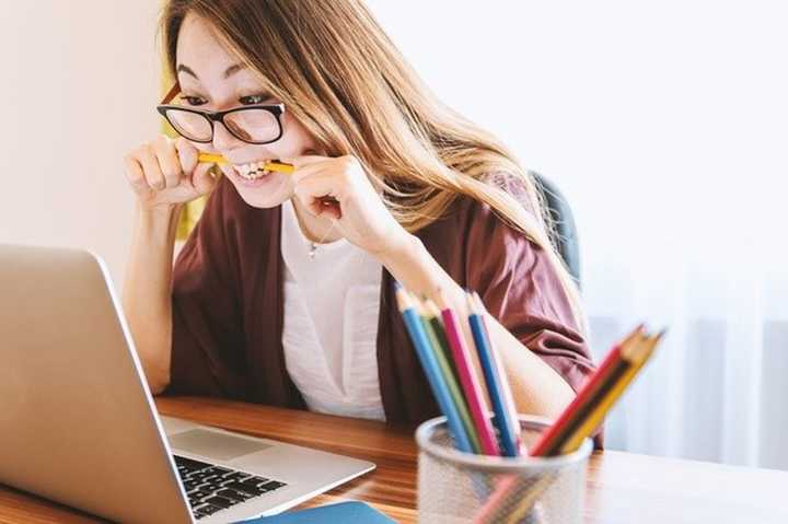 A stressed woman at her computer