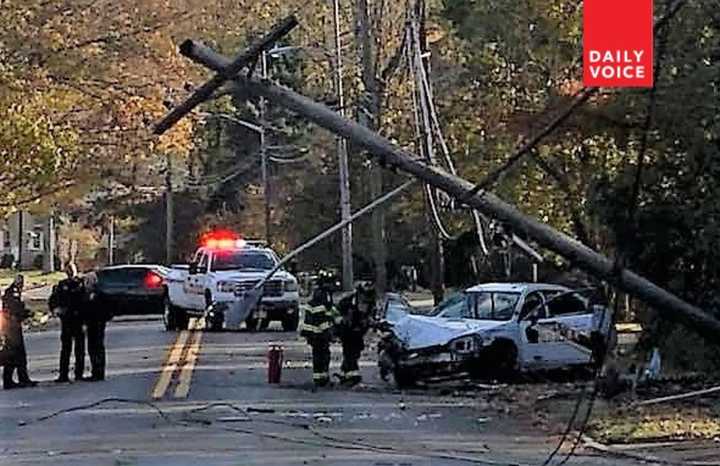 A good Samaritan helped get the officer out of the car, witnesses said.