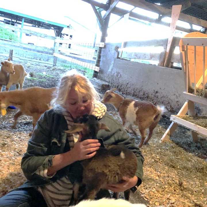 Lisa Miskella at Freedom Farm Animal Sanctuary with Matilda the goat.