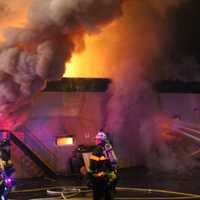 <p>Flames shot through the roof of the uniform supply store on Main Street in Lodi.</p>