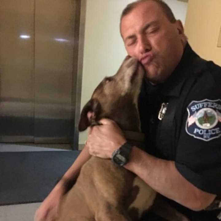 A little lost doggie smooches Suffern police Officer John Roberts Monday. The pooch was found wandering around Oakdale Manor and was taken to the Hi Tor Animal Care Center in Pomona.