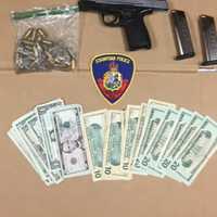 <p>Drugs, gun, and pills seized during the bust.</p>