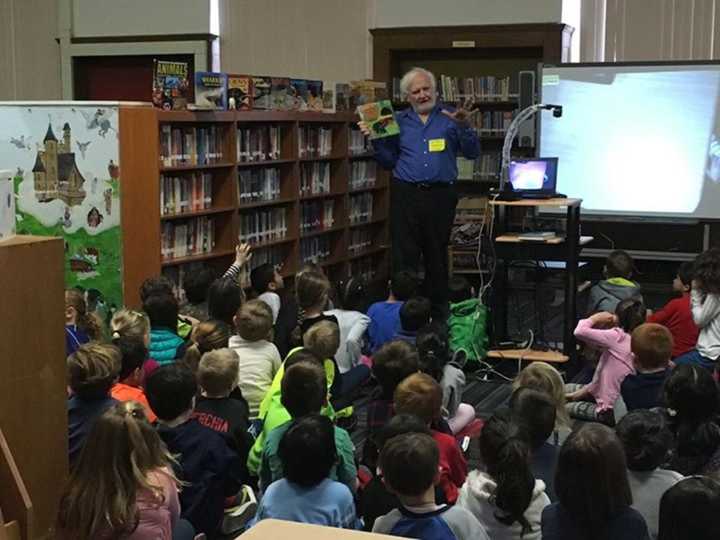 Students are rapt as they listen to author Laurence Pringle talk about one of his books.