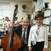 <p>South Orangetown music teacher Matt Rotjan, shown with an unidentified student, is a quarterfinalist in a contest for the 2017 Music Educator Award, which is given out by The Recording Academy and the Grammy Foundation.</p>