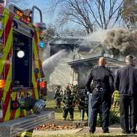 <p>Hawthorne Mayor Richard Goldberg (far right) was among those at the scene of the Washington Avenue fire.</p>