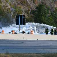 <p>Firefighters doused the flames with foam.</p>