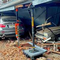 <p>The BMW wagon slammed into the garages at the Elmwood Terrace Apartments, causing substantial front-end damage to the vehicle as well as damage to the garages, shortly after 2:30 p.m. Friday, Nov. 25, Elmwood Park Police Chief Michael Foligno said.</p>