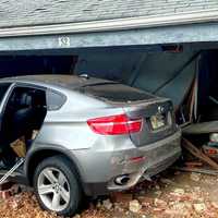 <p>Part of the Elmwood Terrace complex in Elmwood Park was temporarily evacuated after a vehicle driven by a drunk motorist slammed into a row of garages Friday afternoon, Nov. 25.</p>