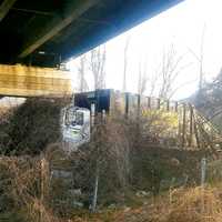 <p>The garbage truck got knocked clear off westbound Route 80 in Bergen County early Monday, Feb. 27.</p>