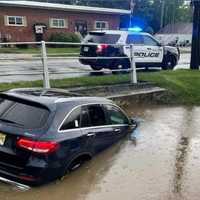 <p>The partially submerged Mercedes in Norwood.</p>