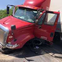 <p>The jackknifed tractor lost its tank, leaking fuel.</p>