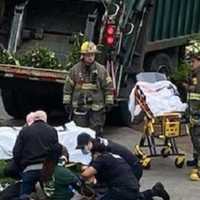 <p>EMS workers tend to the victims.</p>