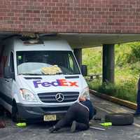 <p>Tow truck crew removes wheels.</p>