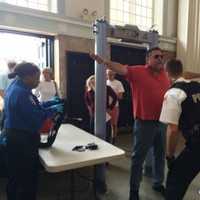 <p>Everyone passes through a metal detector on their way into the Klein in Bridgeport for the rally Saturday for presidential candidate Donald Trump.</p>