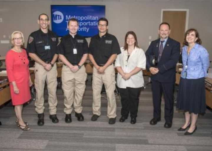 MTA officials with the Westchester first responders that helped save a life on the New Haven Line.