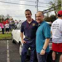 <p>Officer Panza and Chief Salvatore of the Monroe Police Department participated in the Walk a Mile in Her Shoes event in Fairfield Saturday morning.</p>