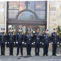 <p>The Norwalk Police Honor Guard pays their final respects to retired Lt. Tim Murphy at the church.</p>