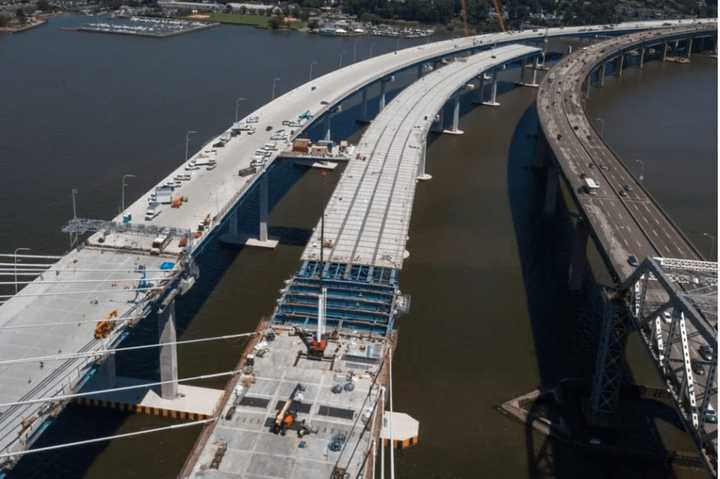 Construction workers are busily working to prepare the new bridge of the Rockland-bound opening on Aug. 25.