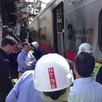 <p>U.S. Sen. Chris Murphy gets an up-close look at the damaged trains. </p>