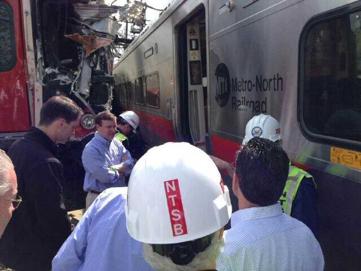 U.S. Sen. Chris Murphy gets an up-close look at the damaged trains. 