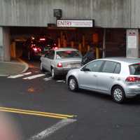 <p>Cars line up to enter the garage in downtown Stamford by the train station. It was filling up by 7 a.m., with only roof parking left.</p>