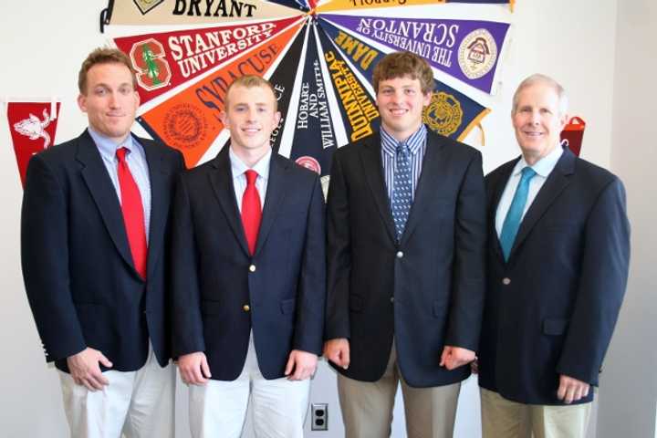 From left: Fairfield Prep Asst. Football coach Keith Hellstern, players Liam Coyle and Chris Golger, and head football coach Tom Shea &#x27;73 celebrate the players; decisions to play NCAA football next year.