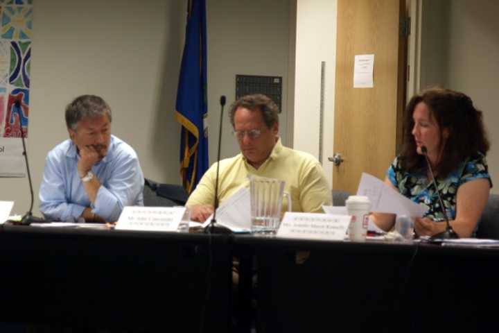 From left: Fairfield Board of Education members Perry Liu, John Convertito and Jennifer Maxon Kennelly look into the Fairfield Public Schools budget for next school year.