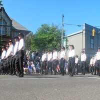 <p>Marchers step off in the Westport Memorial Day parade. </p>