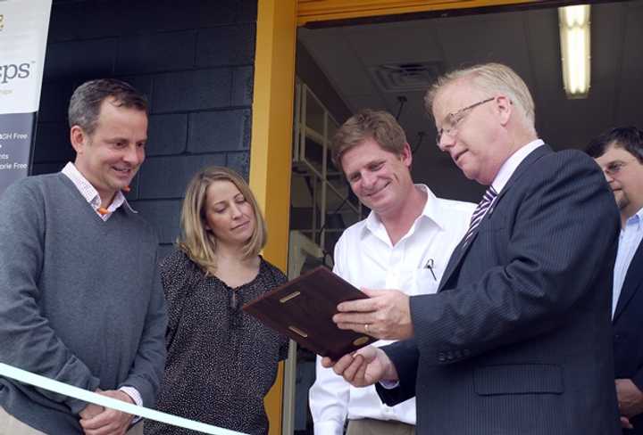 Danbury Mayor Mark Boughton presented a plaque to LesserEvil CEO Charles Coristine, Brand Director Kristen Cardilli, and CFO Andrew Strife outside the new factory. 