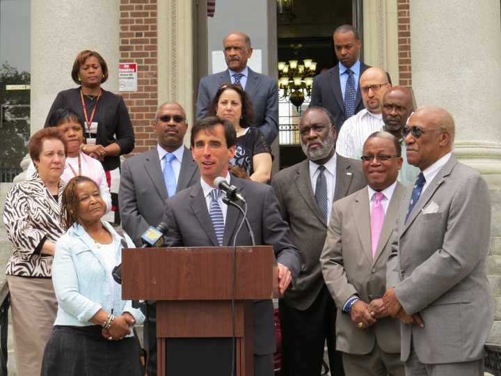 Westchester County Executive hopeful Noam Bramson speaks to a crowd and Mount Vernon officials.