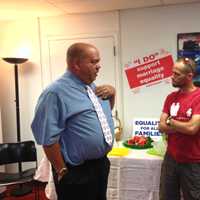 <p>Rich Houston of Mount Vernon (left) and Tony Carlyle of White Plains (right) discuss the Supreme Court decisions on marriage equality at the LOFT LGBT Center&#x27;s reaction celebration.</p>